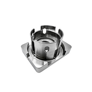 3 Axis machining of an aluminum cylindrical housing with window slots and a chamfered base