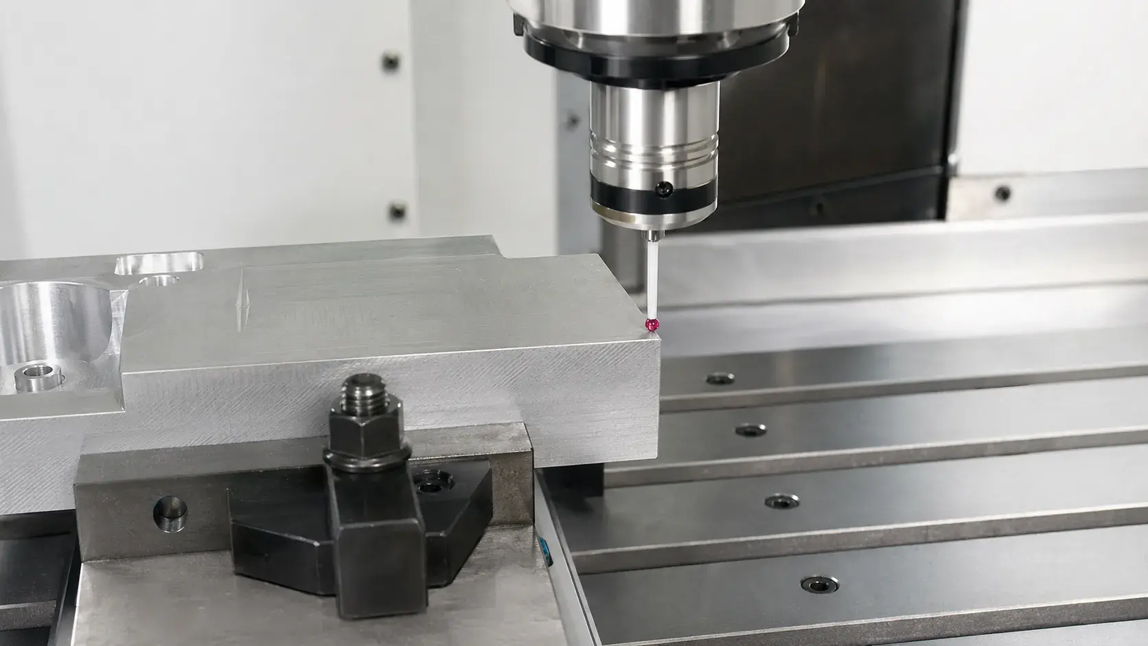 CNC touch probe setting the work zero on an aluminum workpiece