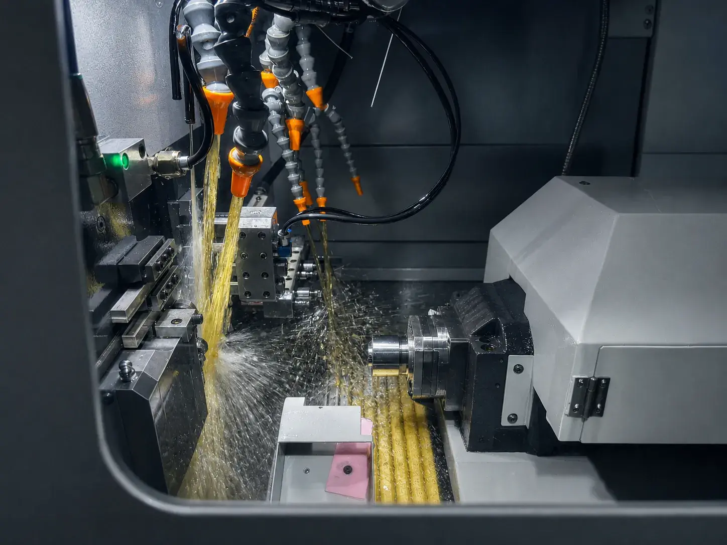 Swiss CNC machining process showing precision cutting and coolant control for small complex parts