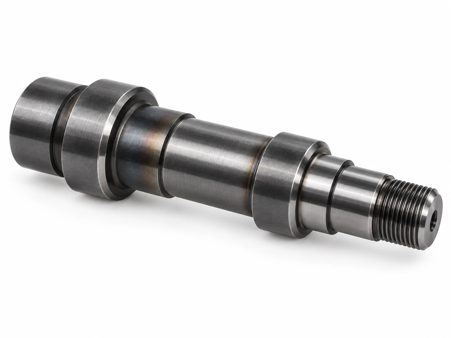 Precision machined carbon steel shaft with heat-treated surface appearance
